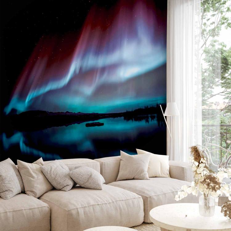 Wall Mural Beautiful aurora - nightscape with a lake and blue glow in the sky