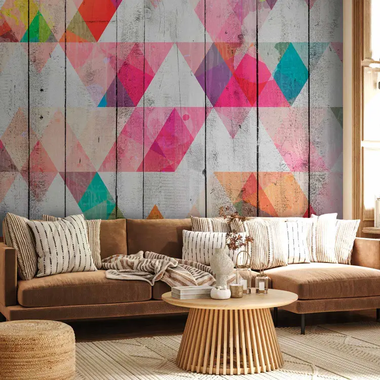 Rainbow Triangles - Colorful geometric figures on gray plank background