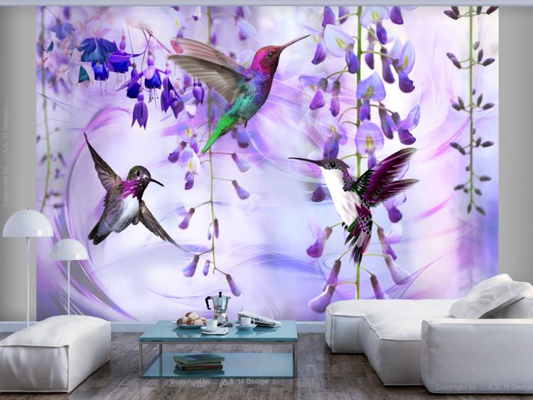 Wall Mural Flying hummingbirds - flying birds motif among flowers in purple