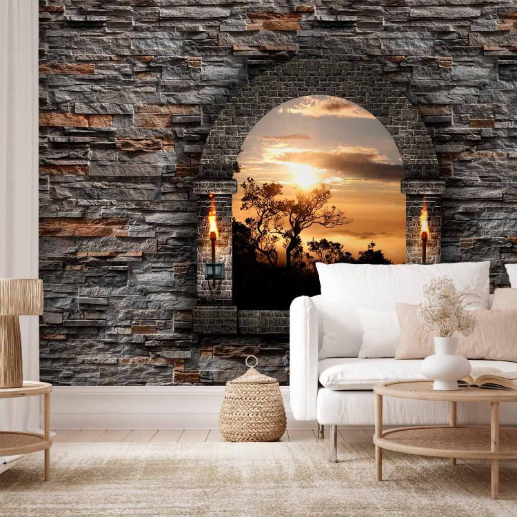 Wall Mural View from a castle window - landscape with outlines of trees at sunset