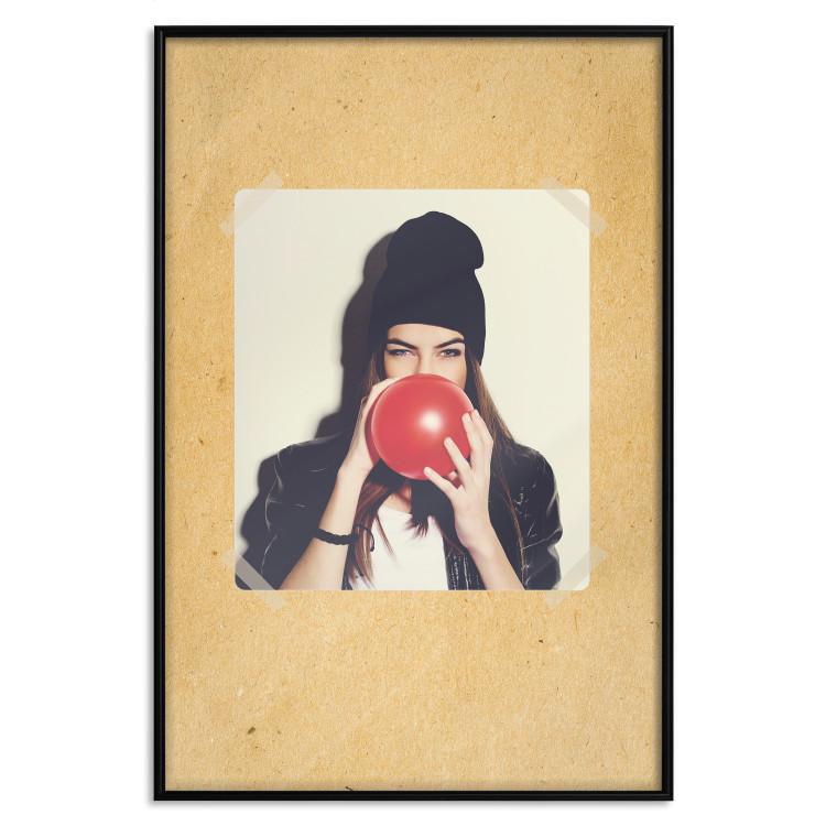 Poster Photo Portrait - figure of a young woman blowing a balloon against a cardboard background