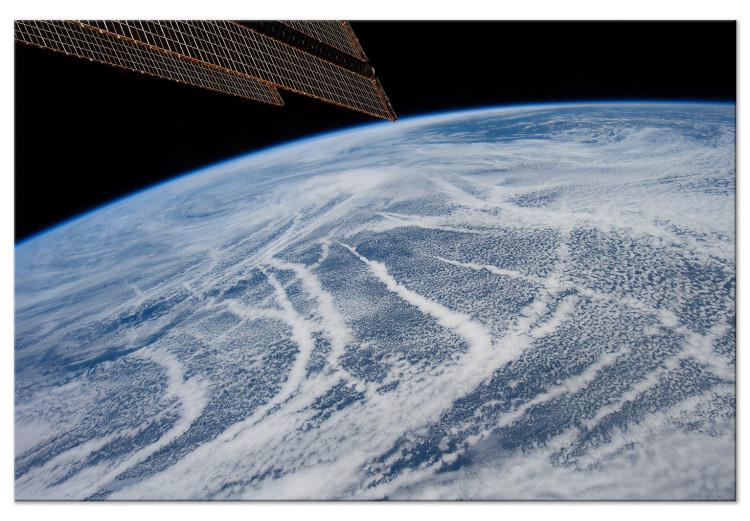 Canvas Print Space flight - a satellite photo of the Earth and the cloud band