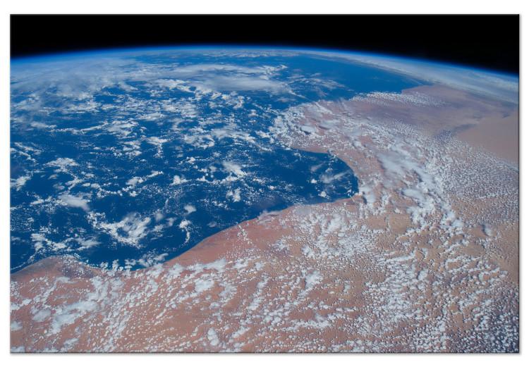 Canvas Print Earth seen from space - a satellite photo of the ocean and land