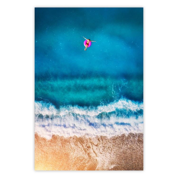 Poster Sea Bathing - woman on float in sand and blue sea background
