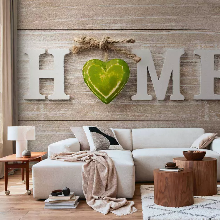 Home sign on a wooden wall - white English text with a heart