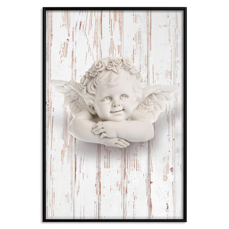 Poster Happy Dawn - sculpture of an angel on a white wooden texture background