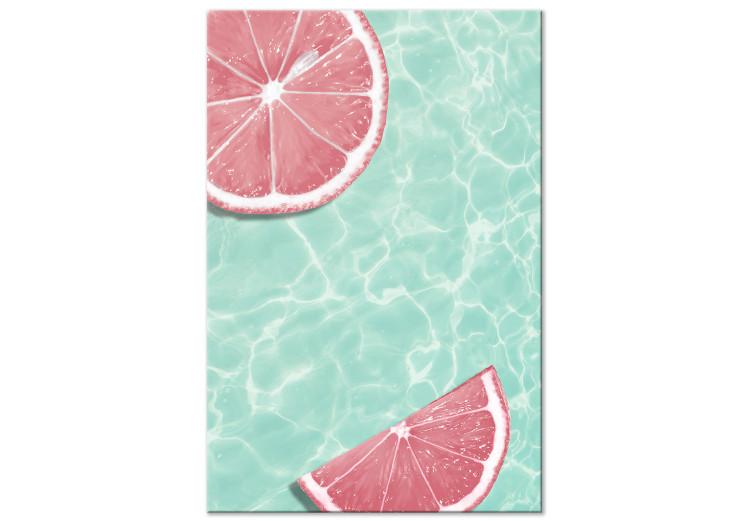 Canvas Print Grapefruit slices floating in turquoise water - summer abstraction