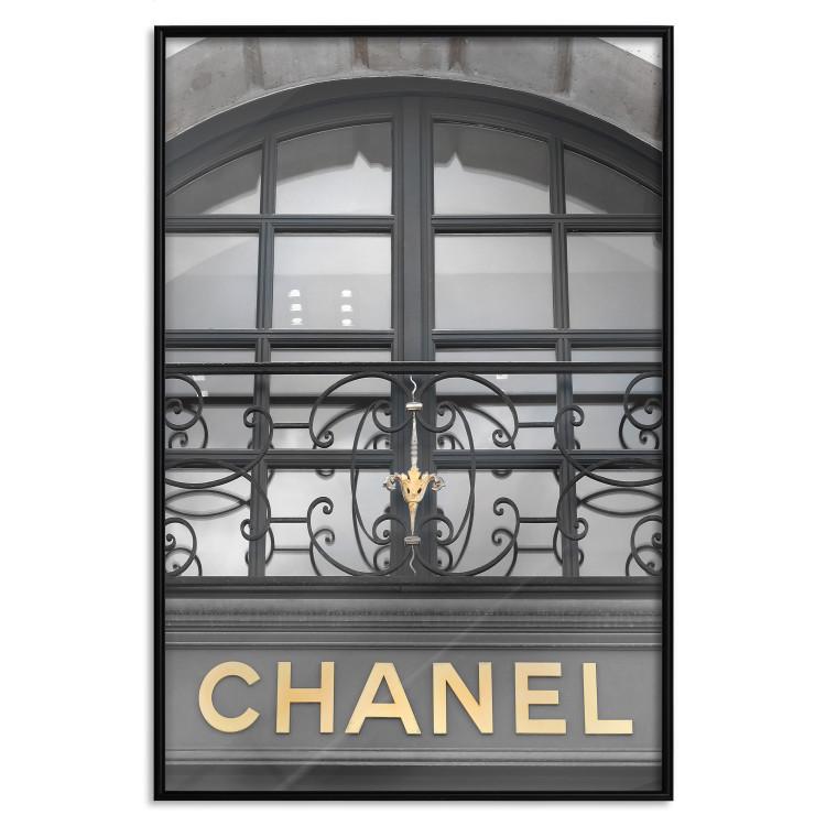 Poster Golden Signboard - golden inscription on black architectural building with window