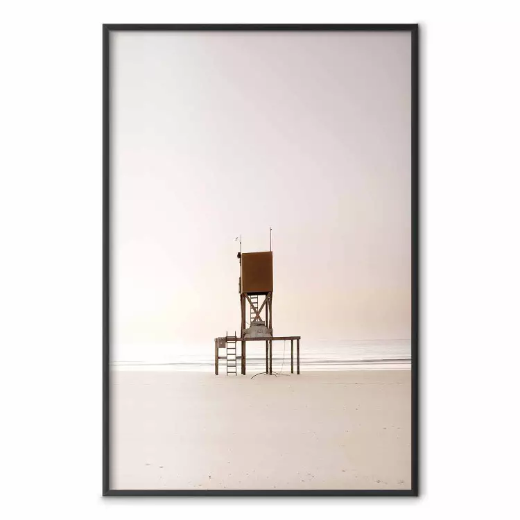 September Dawn - lifeguard tower on the beach in the light of bright sky