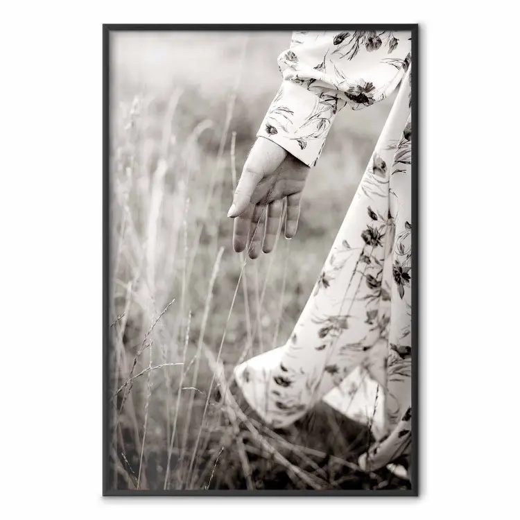 In Touch with Nature - landscape of a woman's hand among plants in a meadow