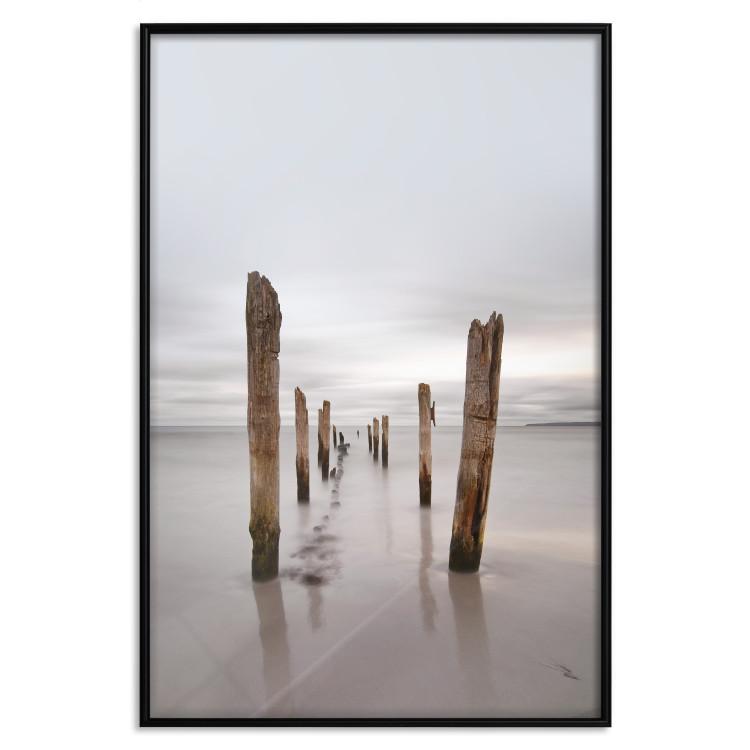 Poster Illusory Calm - seascape with wooden posts against the sky
