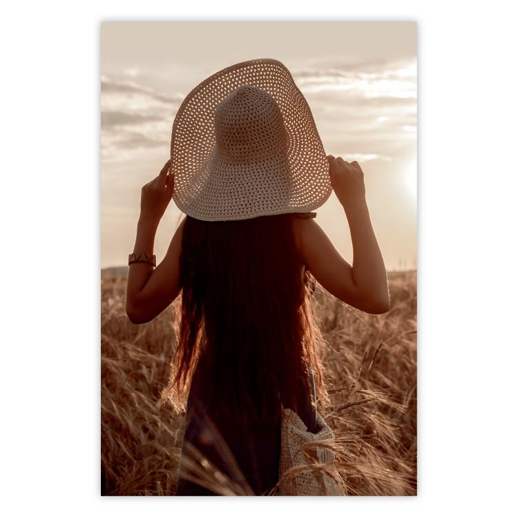 Poster Late Harvest - landscape of a field and a woman against the setting sun