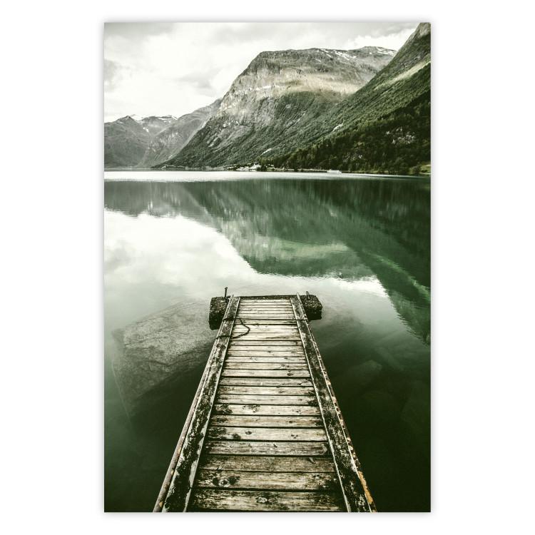 Poster Silence - landscape of a lake with a wooden pier against mountains and sky