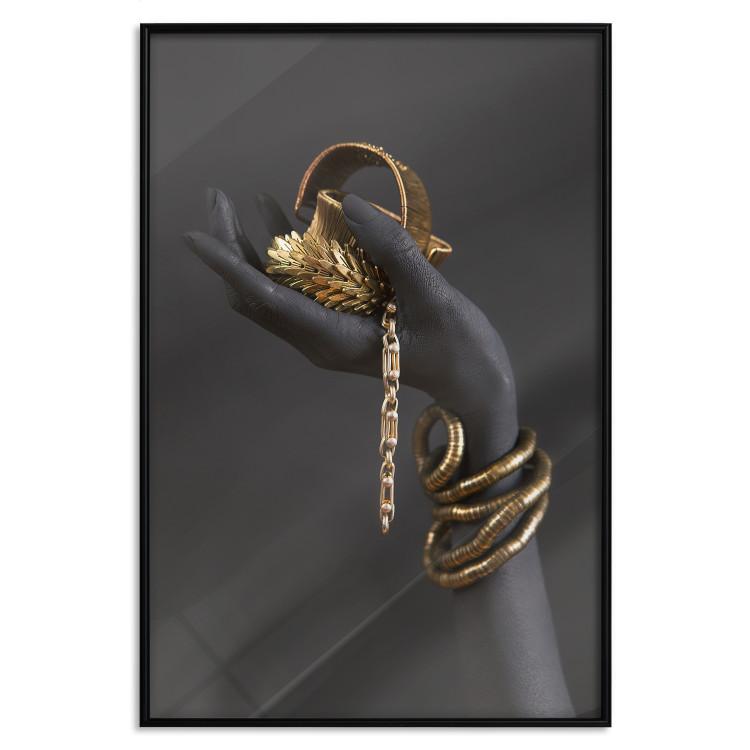Poster Royal Gifts - black hand with golden accessories on a dark background