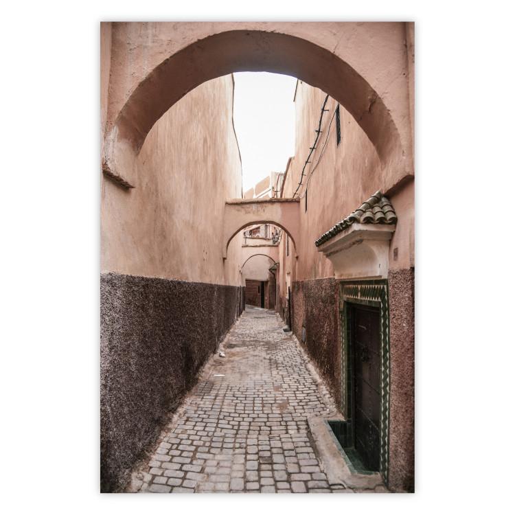 Poster Moroccan Alleys - narrow alley amidst orange buildings