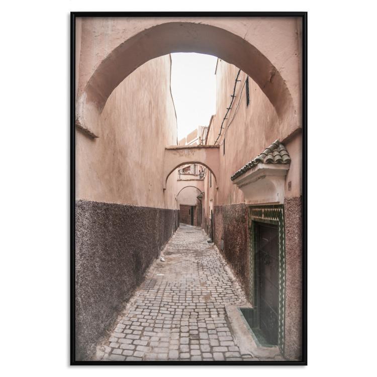 Poster Moroccan Alleys - narrow alley amidst orange buildings