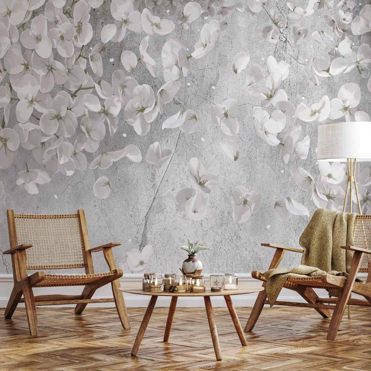 Wall Mural Subtle nature - motif of delicate white flowers on a concrete background