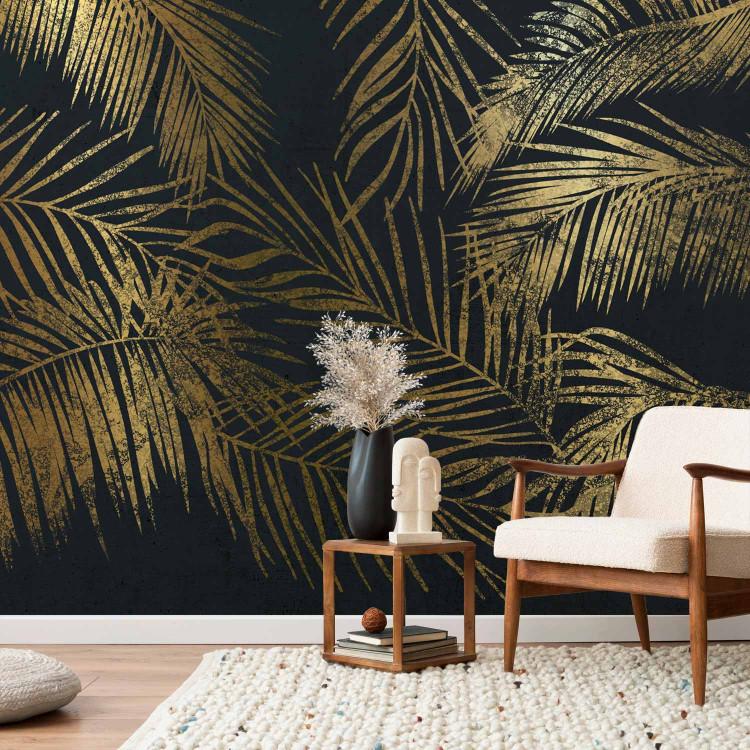 Wall Mural Tropical nature - floral motif of golden palms on a dark blue background