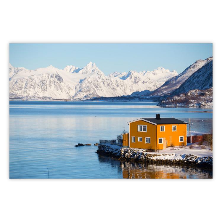 Poster Silence and Peace - winter landscape of a yellow cottage by a lake and mountains