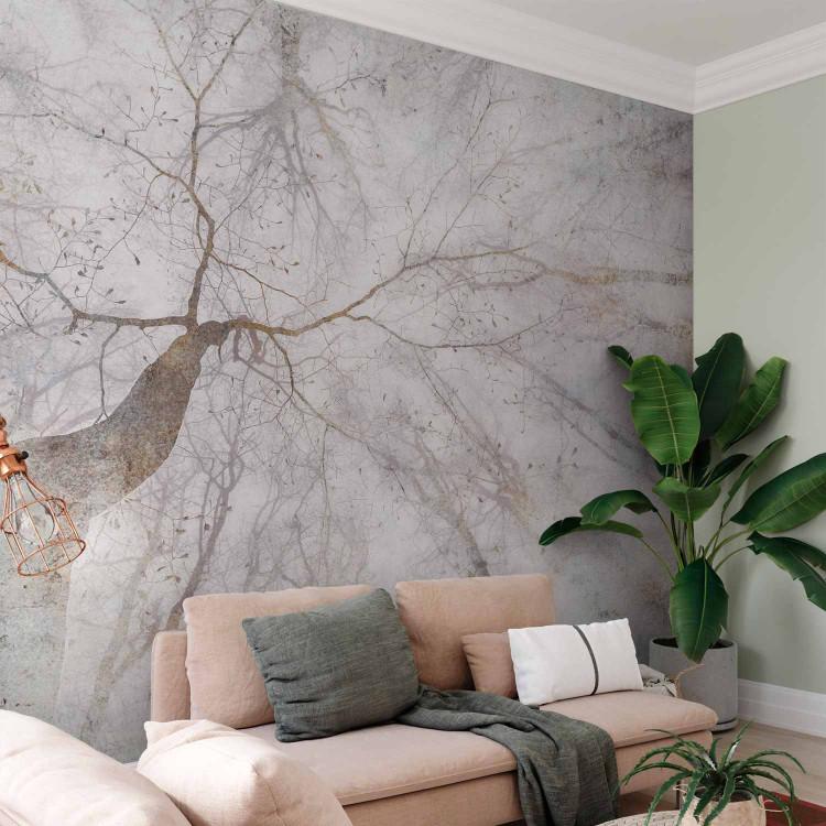 Wall Mural Mist - landscape with tree crown in grey with gold elements