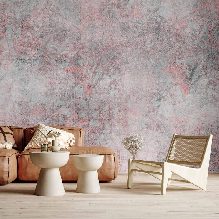 Wall Mural Mosaic - fragments of pink ornaments on a background of concrete texture