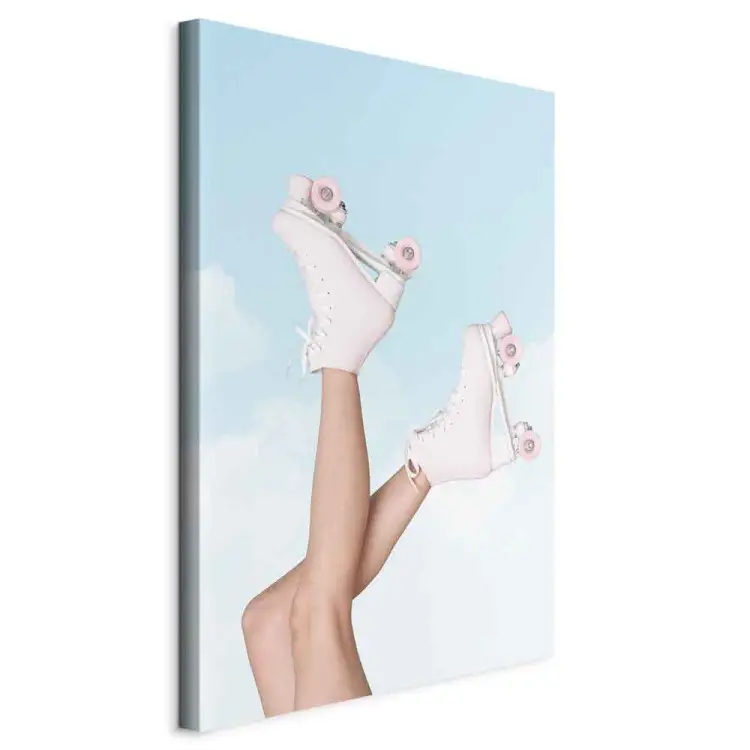 Roller Skates Against Blue Sky - woman's legs up in the air