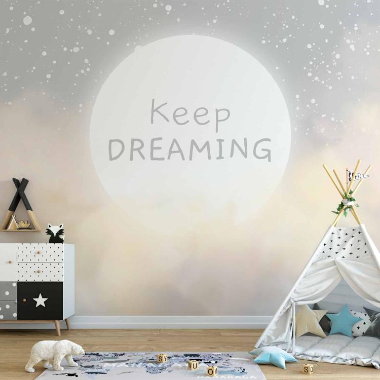 Wall Mural Keep Dreaming - lettering against a background of sky and clouds in powdery tones