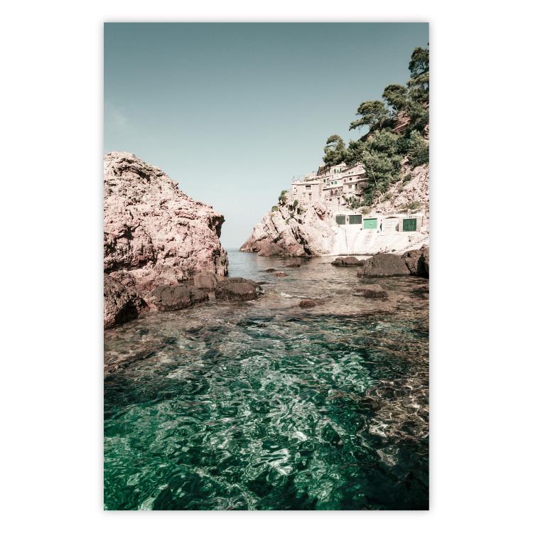 Poster Rocks in the Balearic Islands - Seascape With Houses in the Background