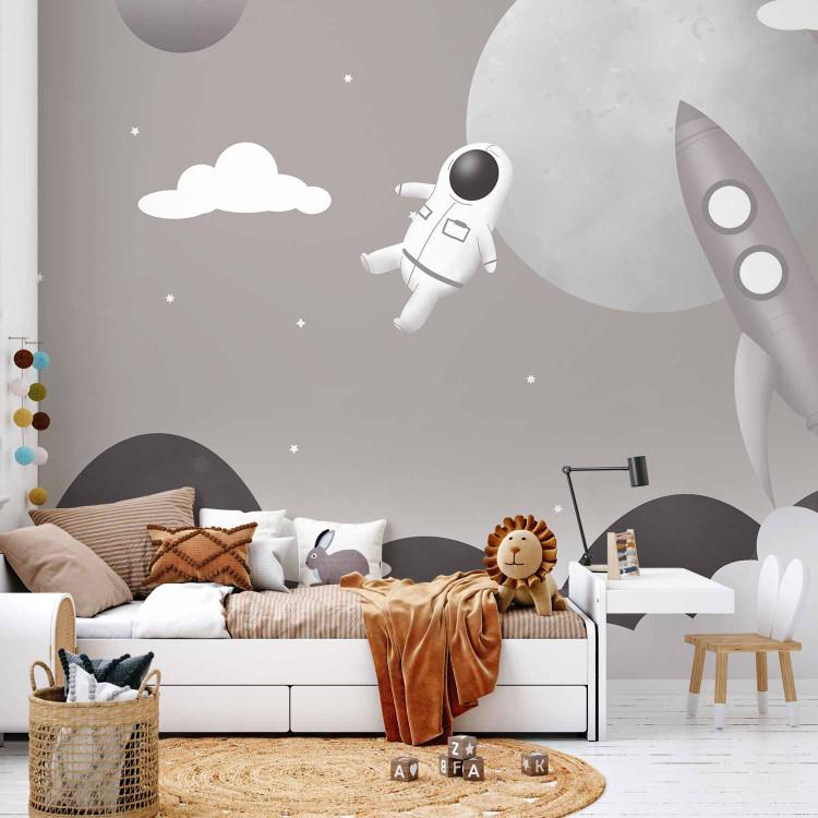 Wall Mural Astronaut in Space - Rocket and Planets in the Gray-Brown Sky
