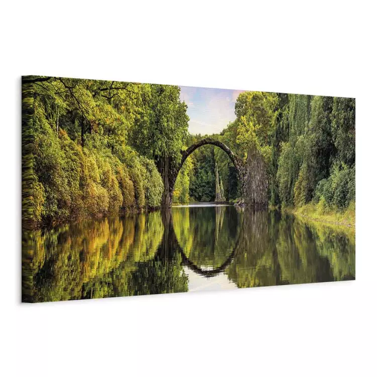 Devil's Bridge - mysterious structure over water surrounded by lush vegetation