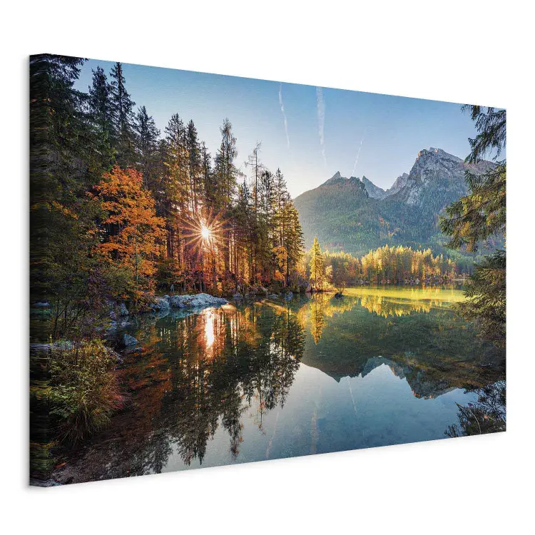 Rays of autumn - the sun breaking through the forest and mountains
