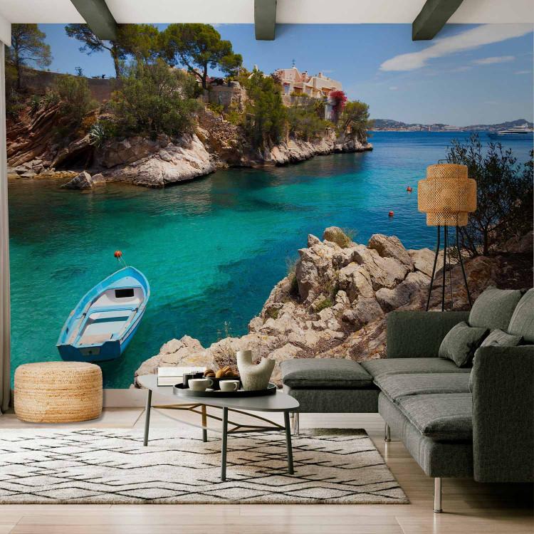 Wall Mural Secluded Cove - Bright Landscape with a Rocky Cove and Moored Boat