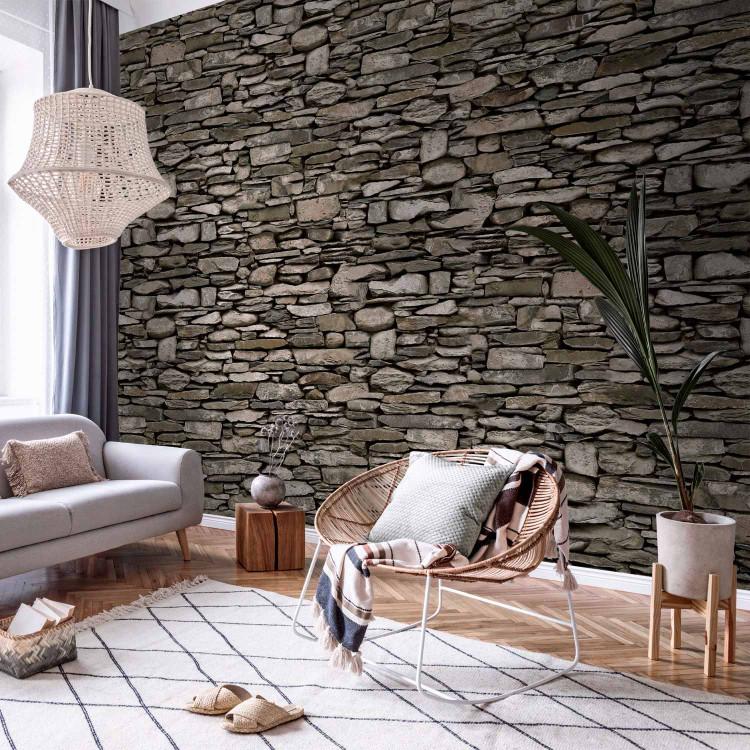 Wall Mural Wall - Wall pattern with gray stones of different shapes
