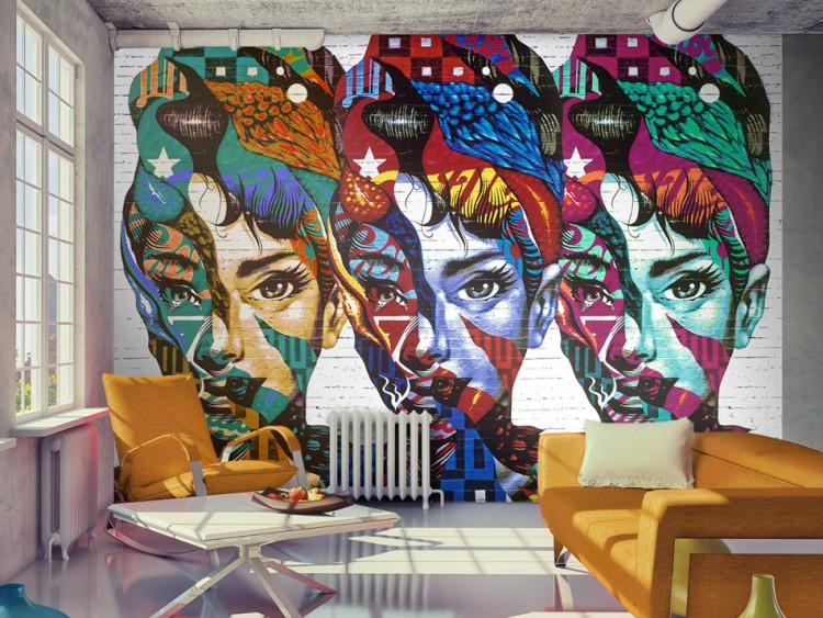Wall Mural Female Silhouettes - Three colorful female faces in a patchwork style