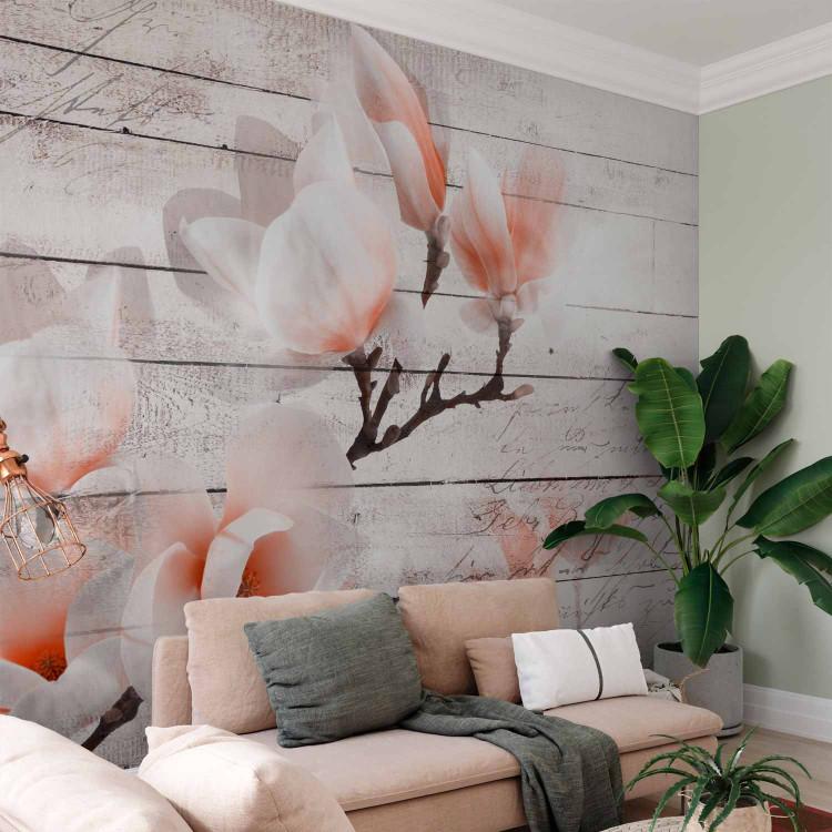 Wall Mural Delicacy of magnolia - orange and white flower against white boards