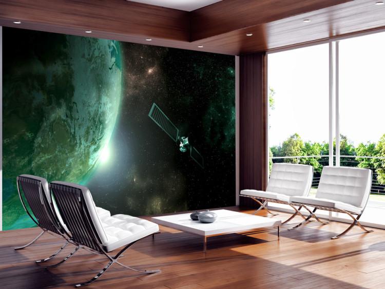 Wall Mural Universe - cosmic landscape with stars, green Earth, and a satellite