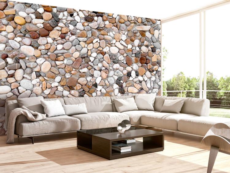 Wall Mural Rocky Beach - Design with Uniform Motif of Various Stones on Sand