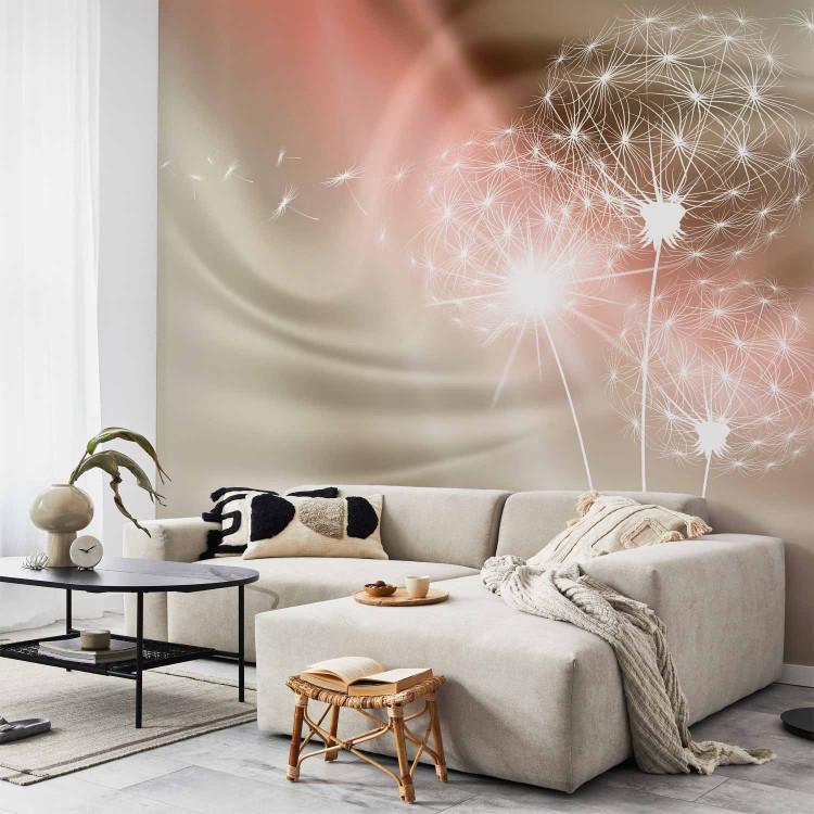 Wall Mural Flying dandelions - white flowers on golden beige background with light
