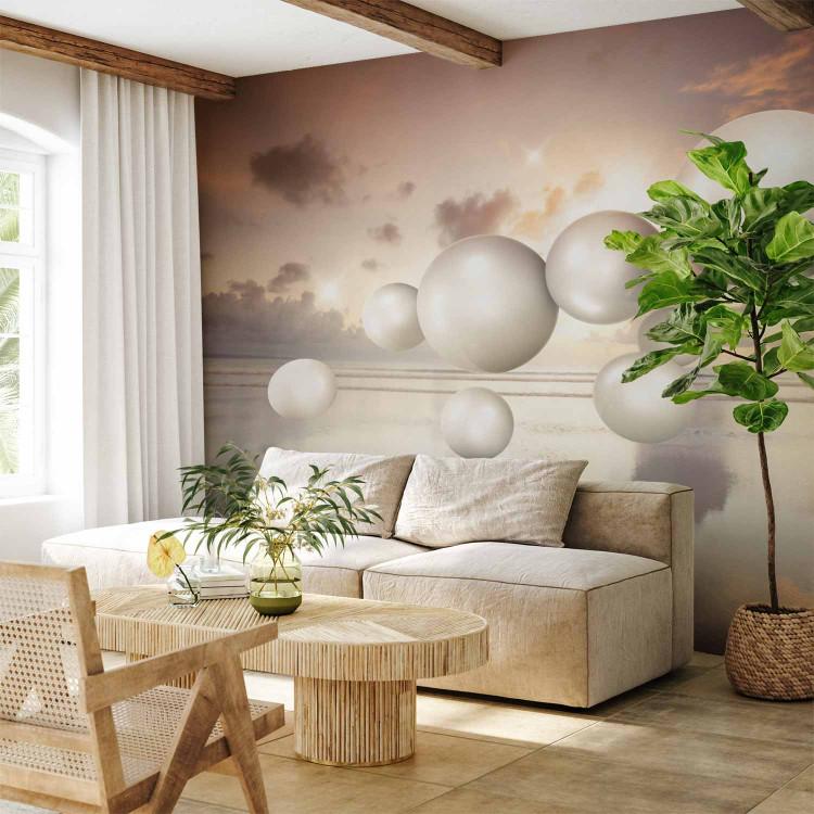 Wall Mural Abstraction with sunrise - white pearls floating above sea water