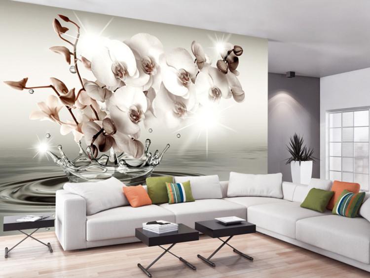 Wall Mural Abstract flowers in water - orchid branch on grey water surface