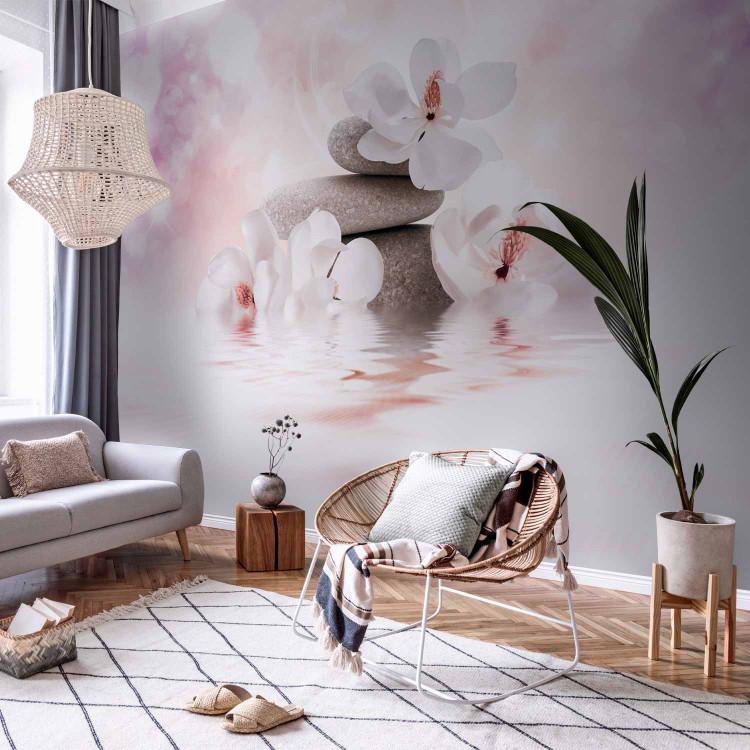 Wall Mural Orient - magnolia flower motif with zen stones on a purple background