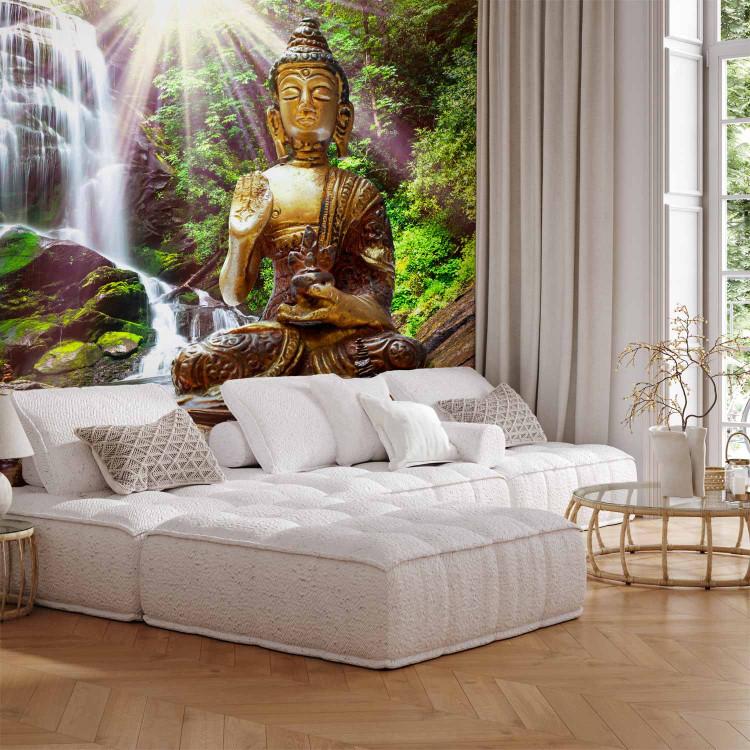 Wall Mural Forest prayer - Buddha sculpture on a background of a waterfall in a sunny jungle