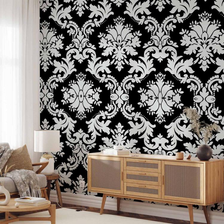 Wall Mural Touch of elegance - white ornaments in baroque style on a black background