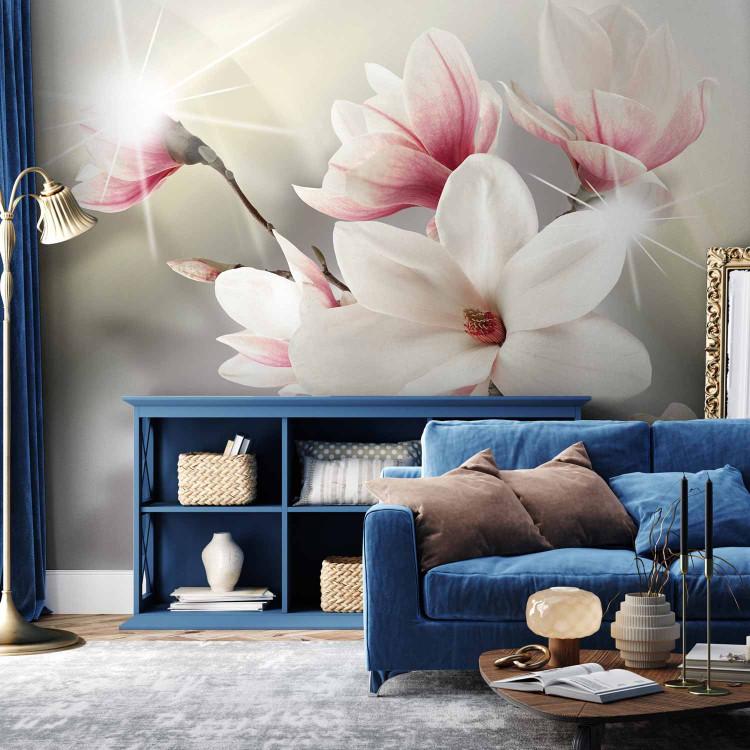 Wall Mural White blooming magnolia branch - flowers on a subtle background with sparkle