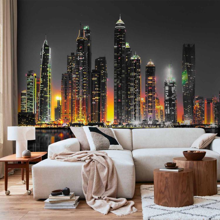 Wall Mural Orange nights Dubai - panorama with skyscrapers and reflection in water