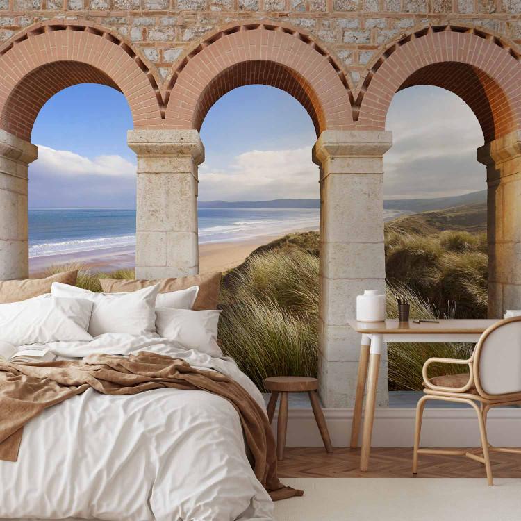 Wall Mural Gates of summer - landscape with beach and sea surrounded by stone columns