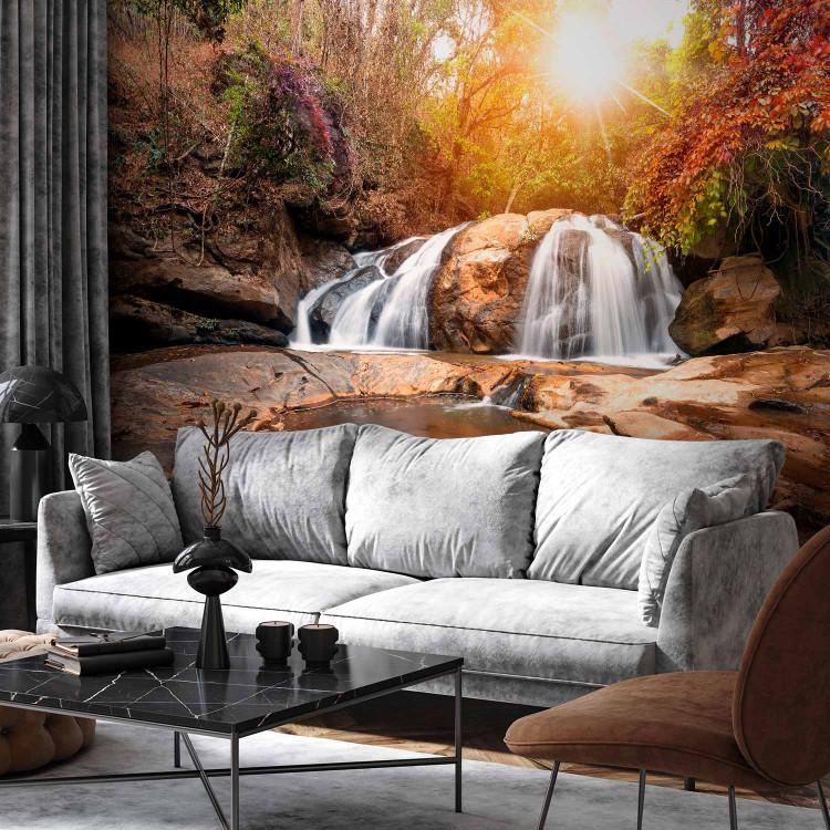 Wall Mural Silence - landscape with a waterfall against a background of autumn forest and sunbeams