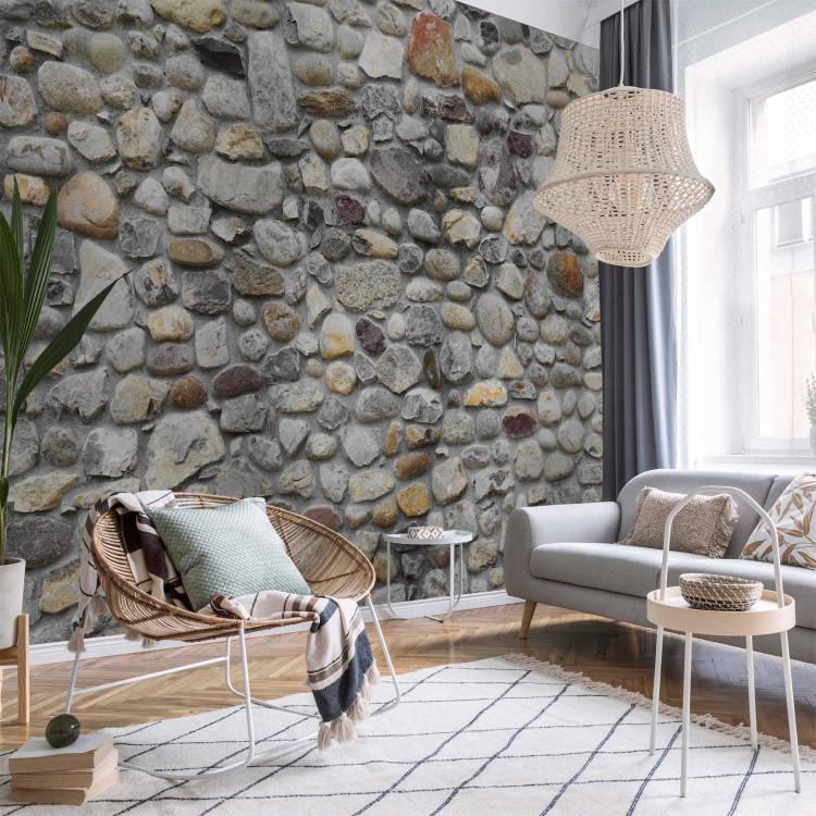 Wall Mural Stone road - background in grey with irregularly textured stones