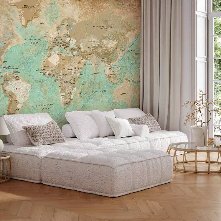 Wall Mural Turquoise world map - continents in shades of beige on a background in green