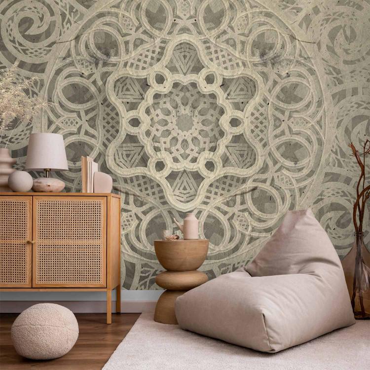 Wall Mural Song of delicacy - beige mandala-type ornaments on a grey background
